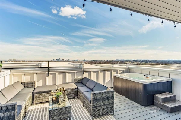 Rooftop Oasis: Unwind under twinkling lights with stunning Nashville skyline views and a hot tub!
