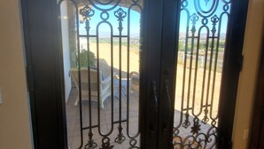 A black door with intricate metalwork and glass panels. - Romantic 1 Bedroom Villa Overlooking the Vineyards with INCREDIBLE VIEWS! (Temecula)