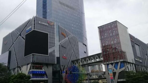A modern building with a glass facade and a unique geometric design. - Yunlin Hotel (Guangzhou)