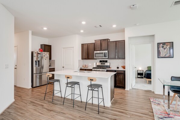 Fridge, microwave, stovetop, cookware/dishes/utensils