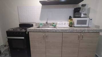 Microwave, oven, coffee/tea maker, cookware/dishes/utensils