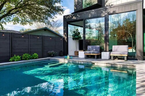 Heated Pool Oasis, Luxe Amenities, Prime Location, Chefs Kitchen, Skyline Views