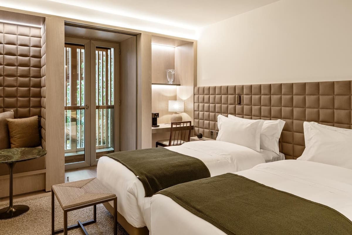 Premium bedding, down comforters, pillowtop beds, minibar