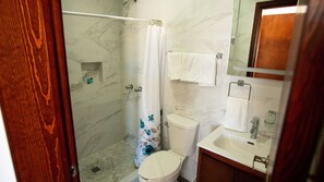 Comfort Condo | Bathroom | Shower, towels, soap, shampoo