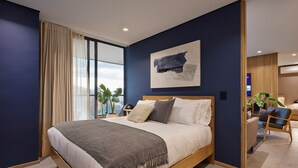 A modern bedroom with a large bed, a city view, and a minimalist design. - 2 bedroom, Ac, 300mb, balcony, jacuzzi, wake 1116 (Medellín)