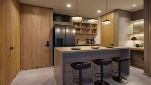 A modern kitchen with a central island, bar stools, wooden cabinets, and pendant lighting. - 2 bedroom, Ac, 300mb, balcony, jacuzzi, wake 1116 (Medellín)