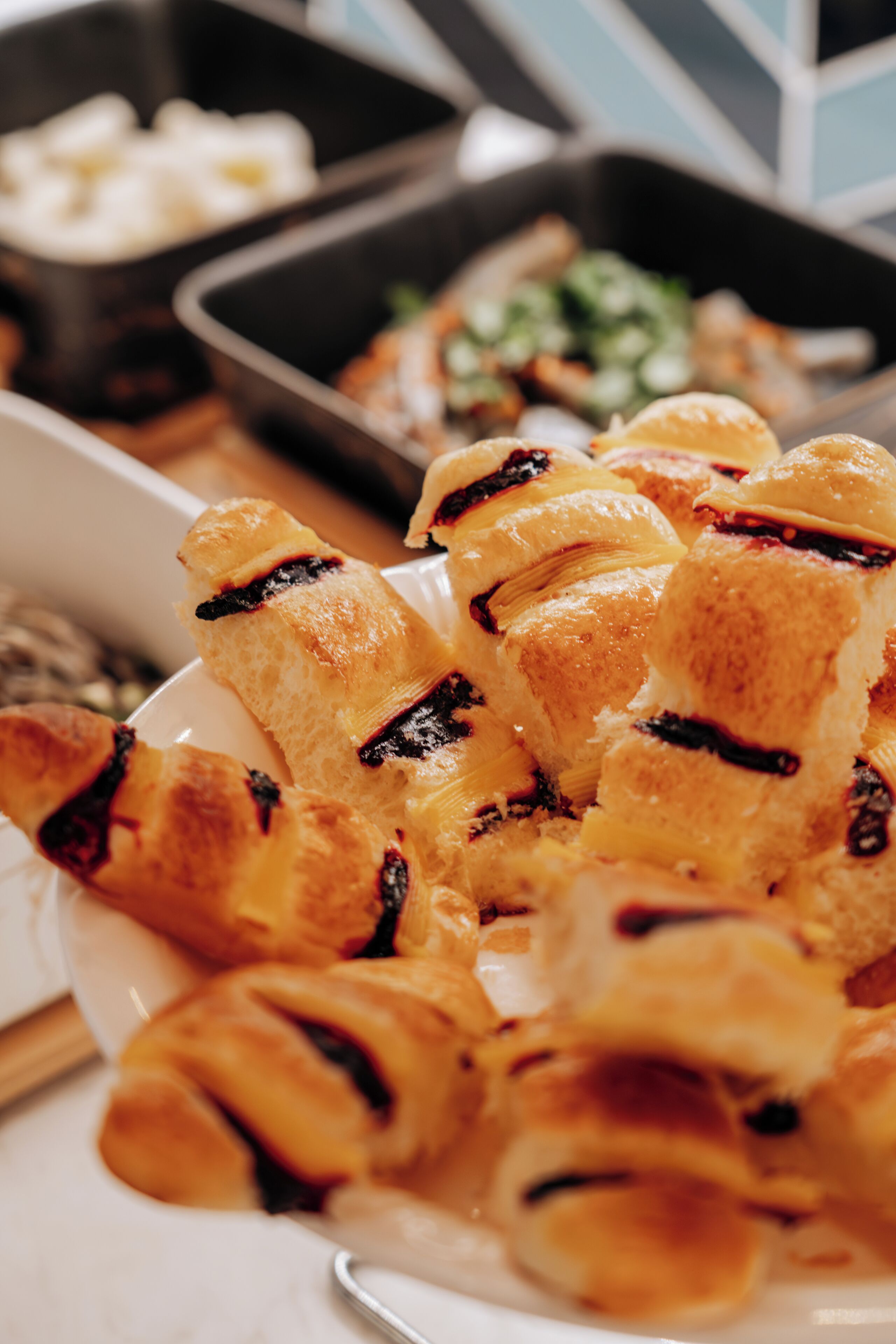 A plate of croissants with chocolate spread.