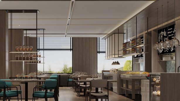 A modern restaurant with a long counter, multiple seating areas, and a variety of food and drink options. - Fairfield by Marriott Lijiang Ancient Town (Lijiang)