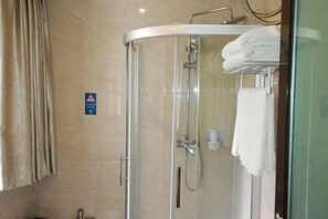 A glass-enclosed shower stall with a towel rack, a hand dryer, and a sign on the wall. - Xiling Shanzhuang Hotel (Dayi)