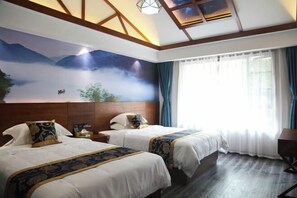 A hotel room with two beds, a large mural of mountains and clouds, wooden beams on the ceiling, and a large window with curtains. - Dongjiangyuan Hotel (Zixing Dongjiang Lake) (Zixing)