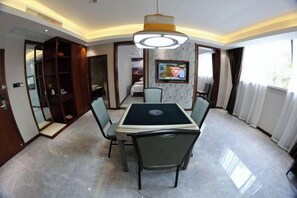 A conference room with a table, chairs, a television, and a large window. - Dongjiangyuan Hotel (Zixing Dongjiang Lake) (Zixing)