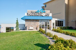A building with a sign reading "The Waterfront American Grille & Event Center". - Boji Vacation is Calling! cabin#147 (Arnolds Park)