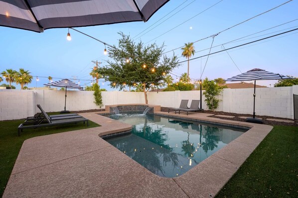 A heated pool, pool loungers