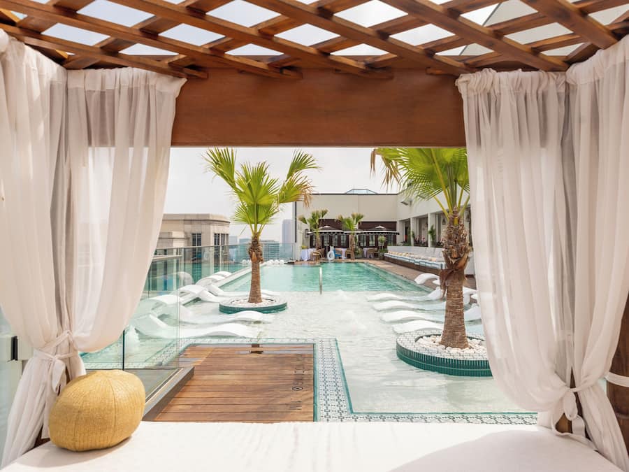 Outdoor pool, open 6:00 AM to 11:00 PM, pool umbrellas, sun loungers