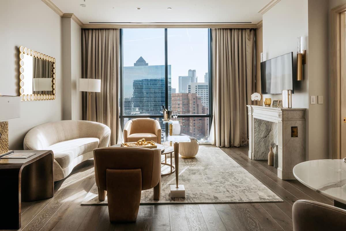 Legacy Suite | Living area | 55-inch flat-screen TV with satellite channels, TV