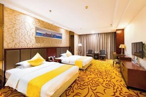 A hotel room with two beds, a desk, a chair, a television, and a cityscape painting on the wall. - Meister Hotel (Chongqing)