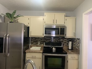 Fridge, microwave, oven, stovetop - Get Cozy at Rim Rd (Fayetteville)