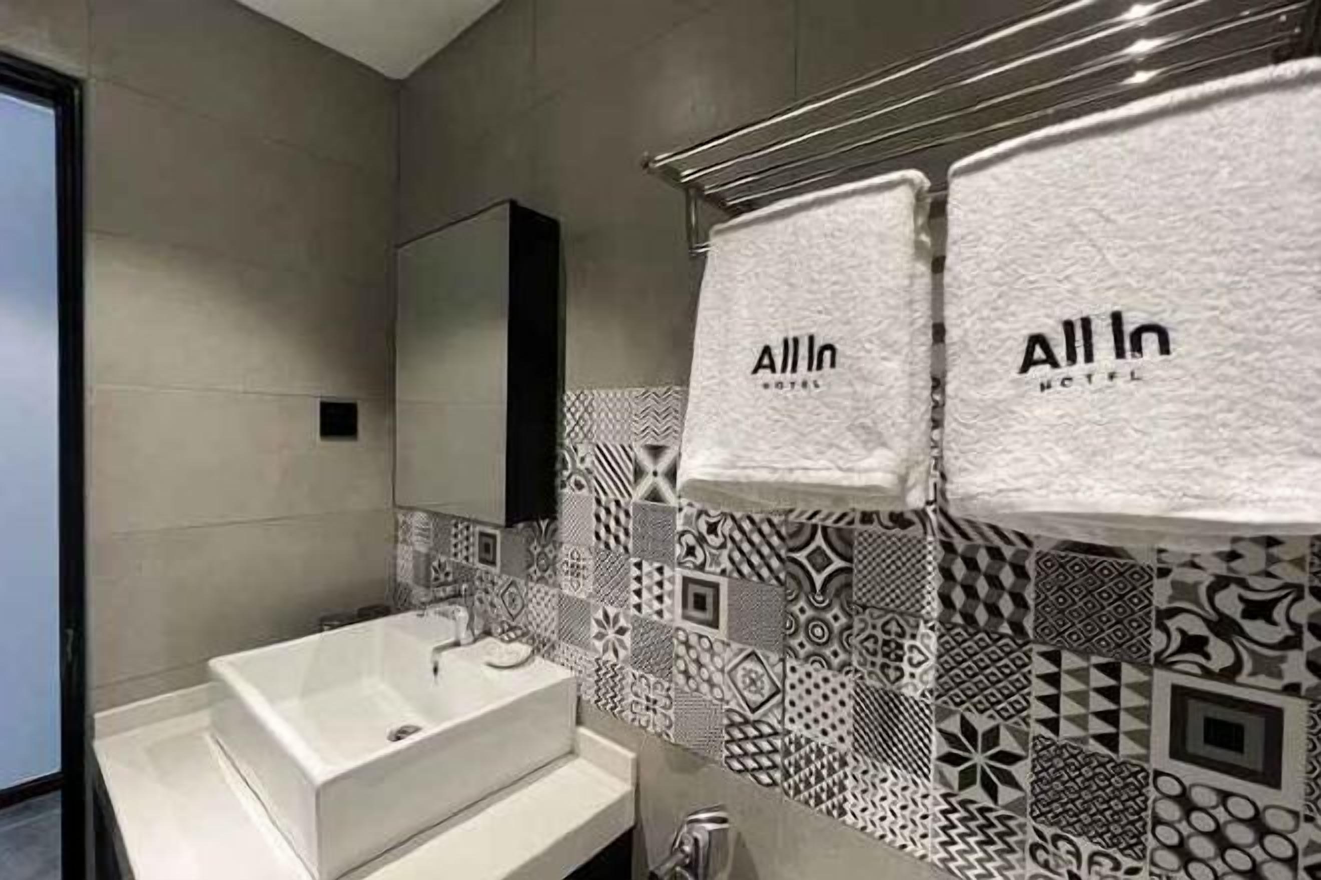 Shower, rainfall showerhead, hair dryer, towels