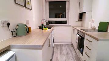Fridge, microwave, stovetop, cookware/dishes/utensils