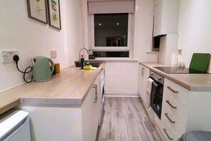 Fridge, microwave, stovetop, cookware/dishes/utensils