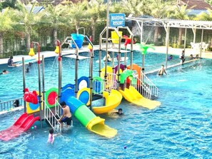 A swimming pool with multiple slides and water play structures. - Marshal Resort (Prachuap Khiri Khan)