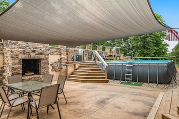 Image of Two-story, dog-friendly home with a pool, indoor/outdoor fireplaces, & AC