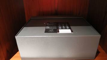 A gray box with a YADA logo on a wooden surface.
