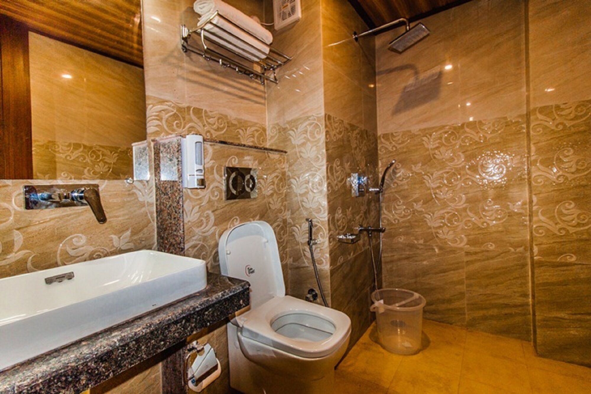 A bathroom with a sink, toilet, and shower.