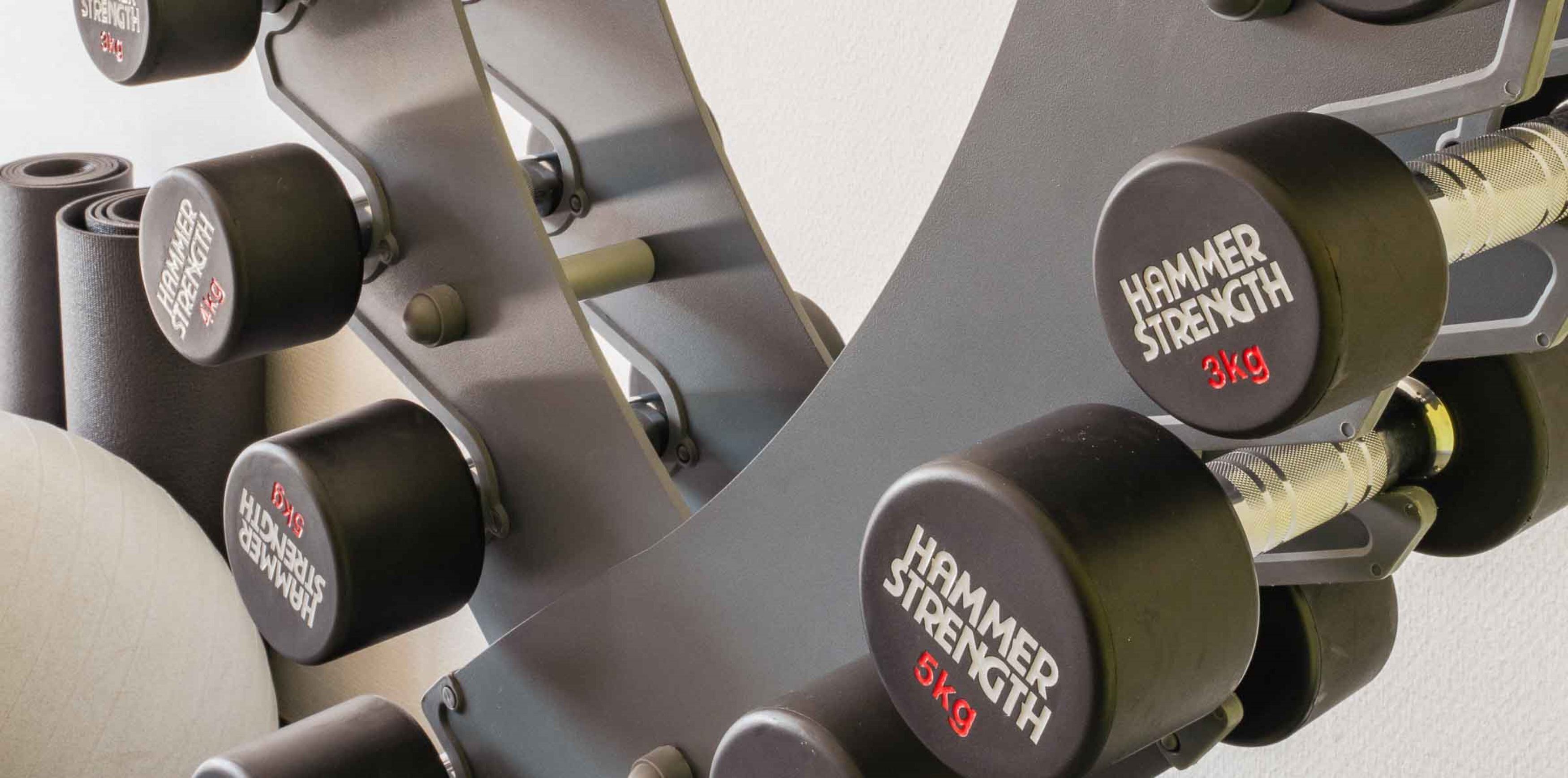 A set of adjustable dumbbells with weight markings.