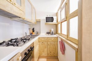 Fridge, microwave, stovetop, coffee/tea maker