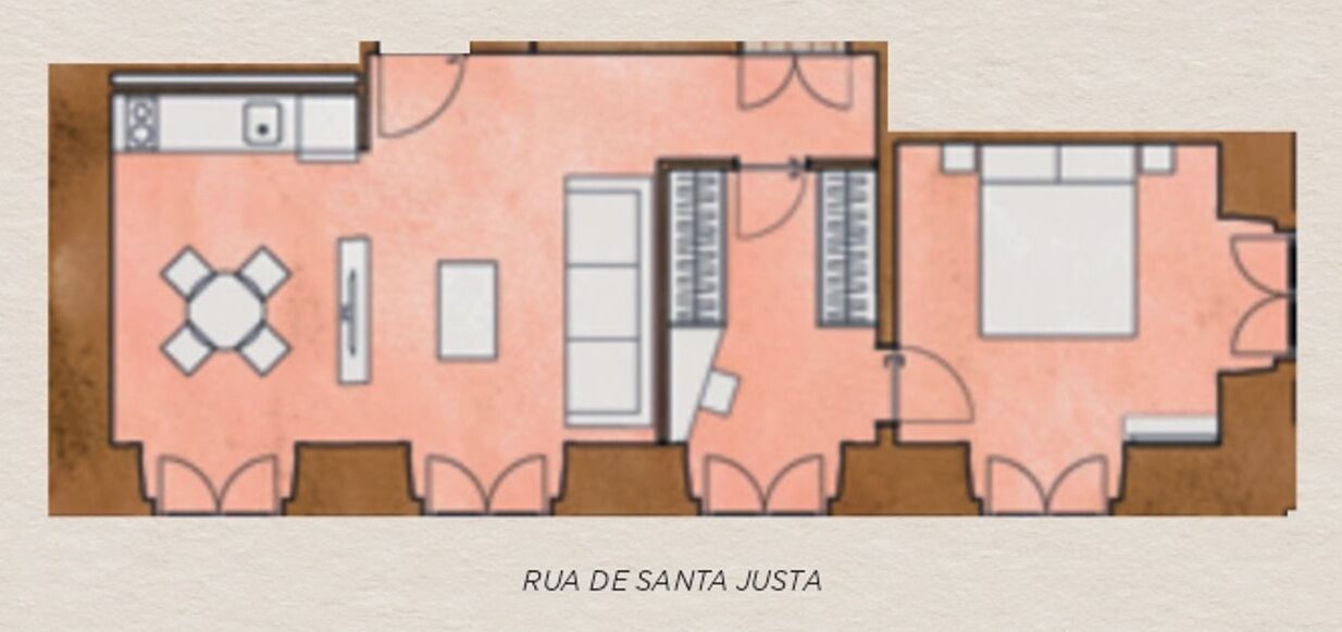 A floor plan of a hotel room with a kitchenette, a dining area, a bedroom, and a bathroom.