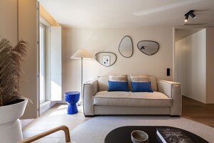 Superior Apartment | Living area | Flat-screen TV