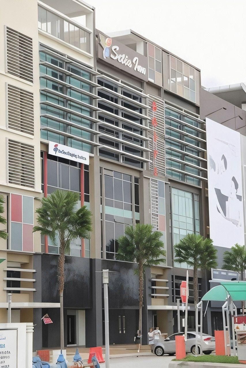 A hotel with a modern facade, multiple balconies, and a prominent signage for 'Saks Hotel'.