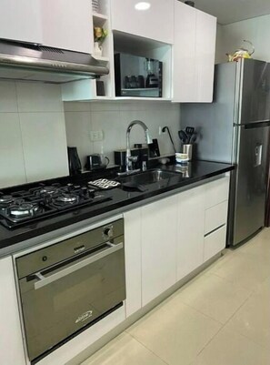 Fridge, microwave, oven, cookware/dishes/utensils