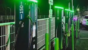 Electric vehicle charging stations with green lighting, a no parking sign, and a maximum power rating sign. - Kyriad Direct Lyon Nord - Dardilly (Dardilly)