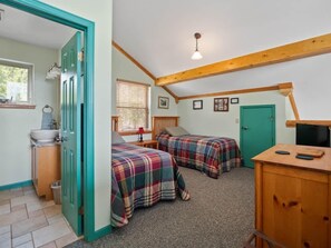 A room with two beds, a sink, a window with blinds, a door, and a ceiling light. - NEW LISTING | Mt. Elbert View Cabin | Sleeps 4 | Leadville (Leadville)