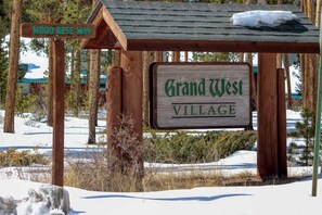 【Grand West Sign】Cabin community entrance marker — your Trapper's Treasure home awaits.