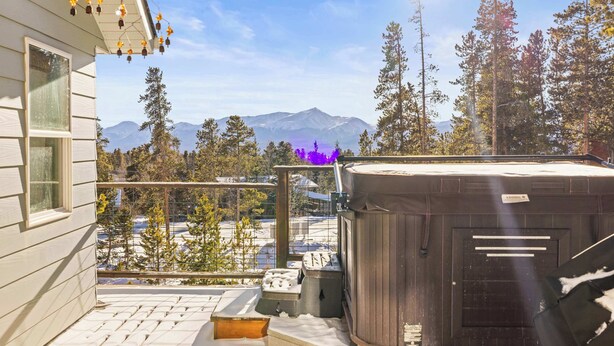 A hot tub on a balcony with a mountain view. - 3BR - Hot Tub, Jacuzzi, Stunning Mt. Elbert Views (Leadville)