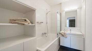 Bathtub, hair dryer, towels