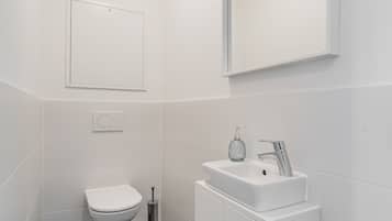 Bathtub, hair dryer, towels