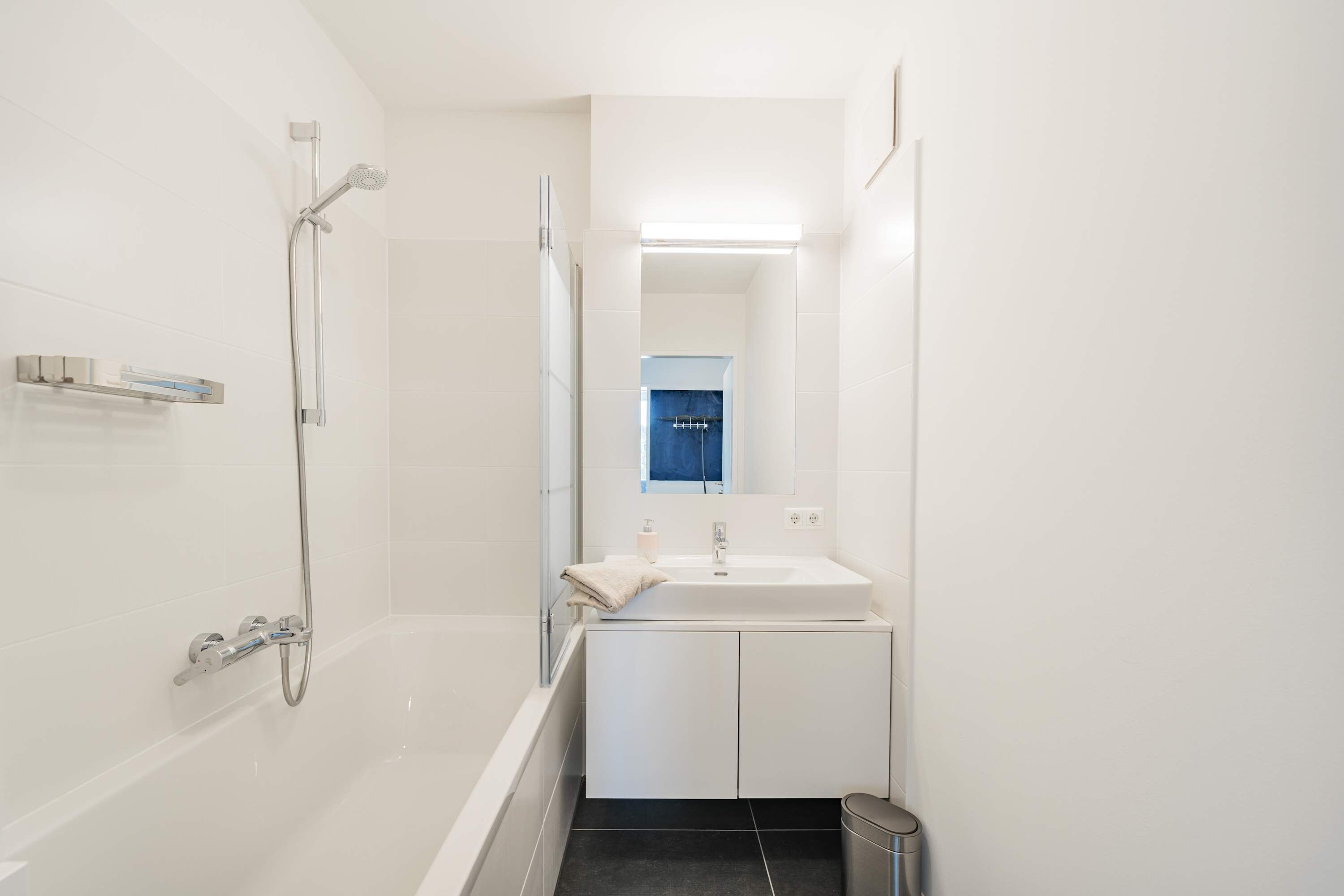 Bathtub, hair dryer, towels