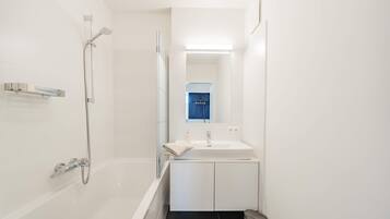 Bathtub, hair dryer, towels