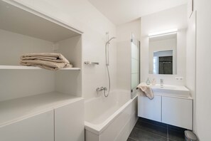 Bathtub, hair dryer, towels