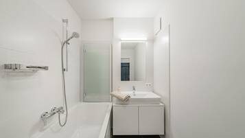 Bathtub, hair dryer, towels