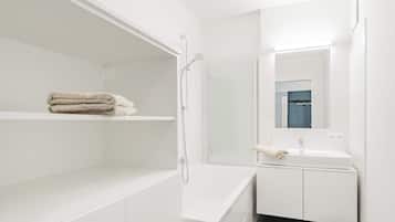 Bathtub, hair dryer, towels