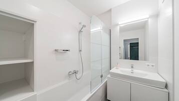 Bathtub, hair dryer, towels