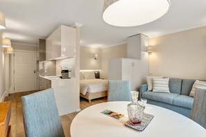 Studio | Living area | 1-inch flat-screen TV with cable channels