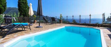 Seasonal outdoor pool, pool umbrellas, sun loungers