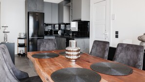 A modern kitchen with a built-in refrigerator, a microwave, and a coffee machine. - Maison du Soleil by CorfuEscapes (Corfu)