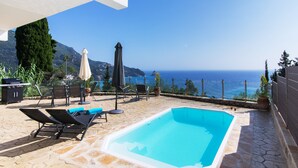 A rooftop pool with lounge chairs, a barbecue, and a view of the sea. - Maison du Soleil by CorfuEscapes (Corfu)